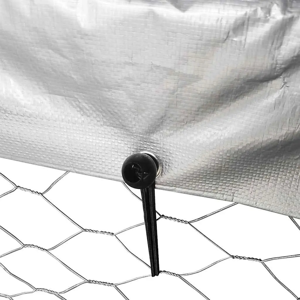 Close-up of polyethylene roof cover secured to steel frame with elastic fasteners on outdoor dog kennel