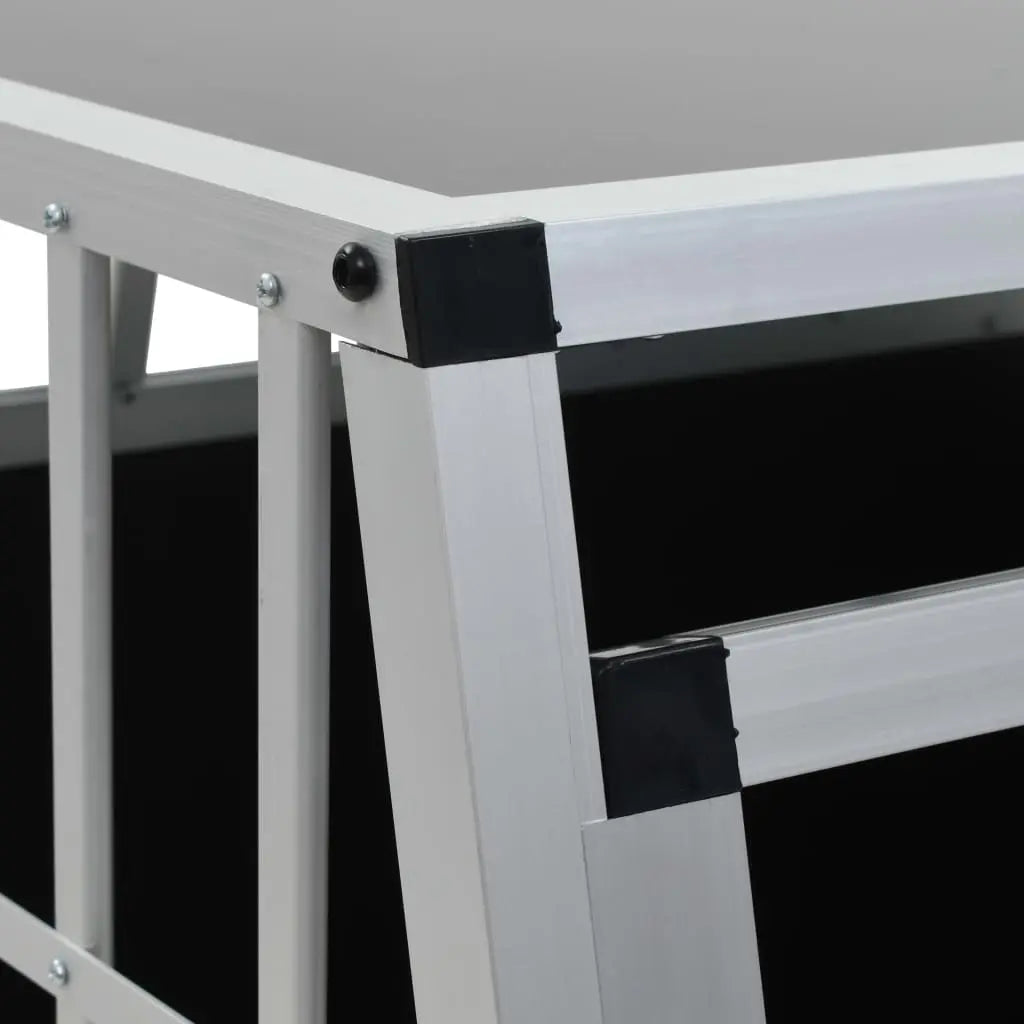 Close-up detail of aluminium frame corner with black plastic connectors on car dog crate